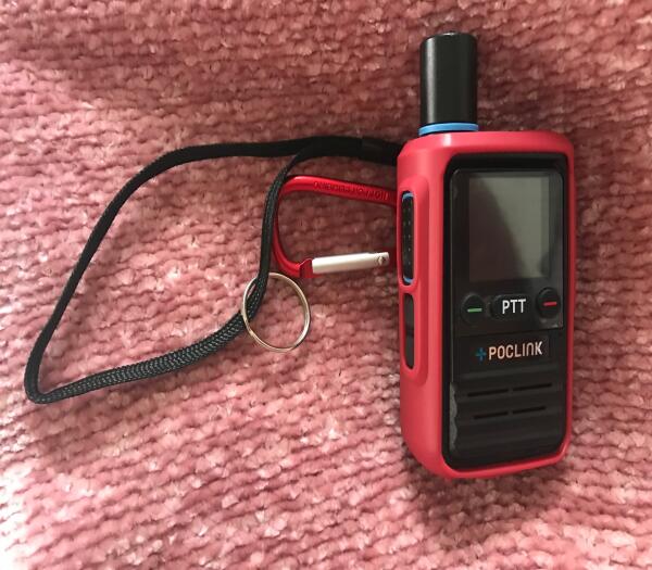 Lost POC Link radio with red cover and carabiner and black wrist holder
